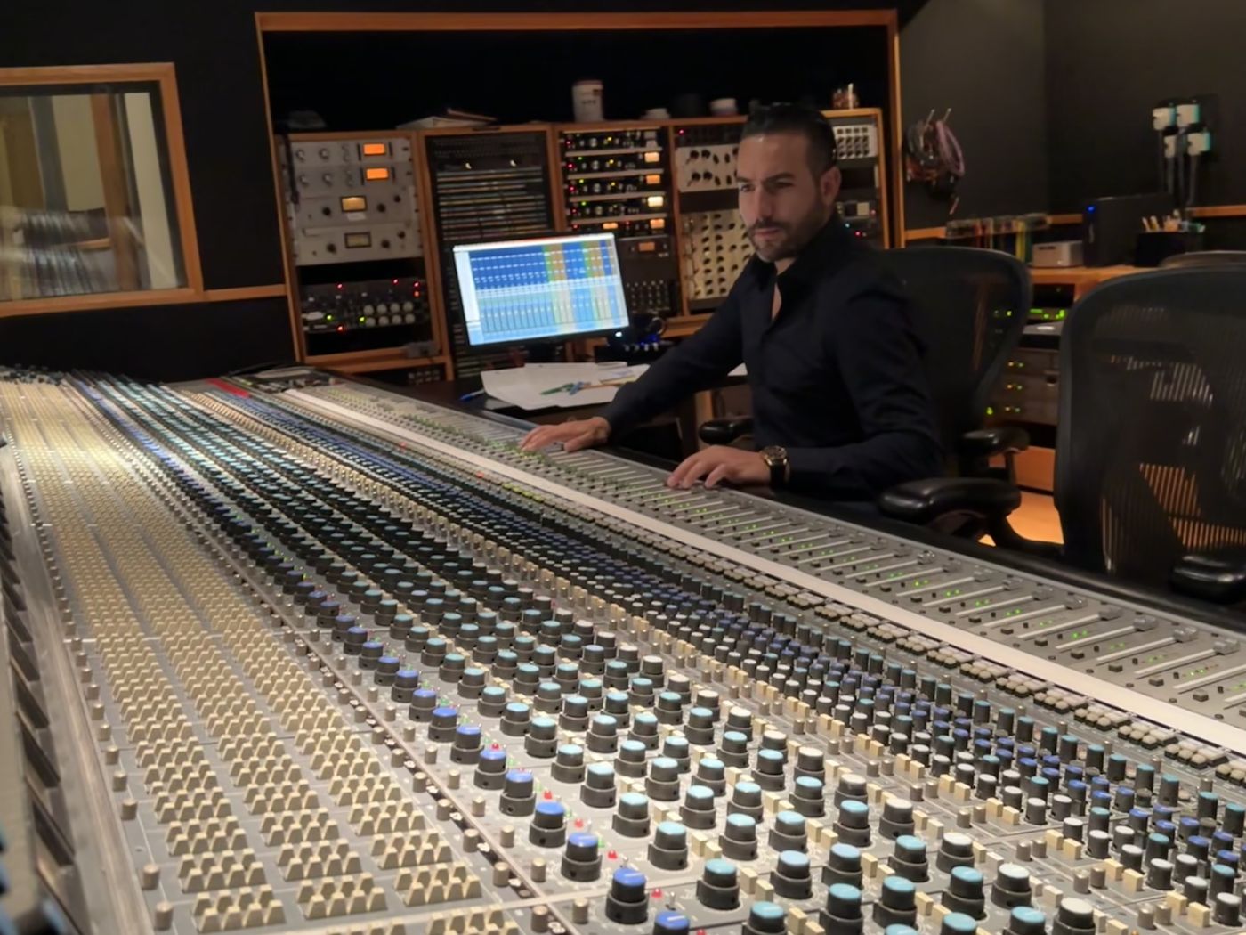 Güney at a large-format mixing console